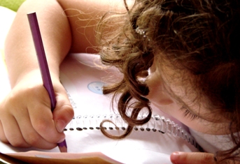 This photo of a young girl working hard at her elementary school studies was taken by photographer Weliton Slima of Sao Paulo, Brazil.